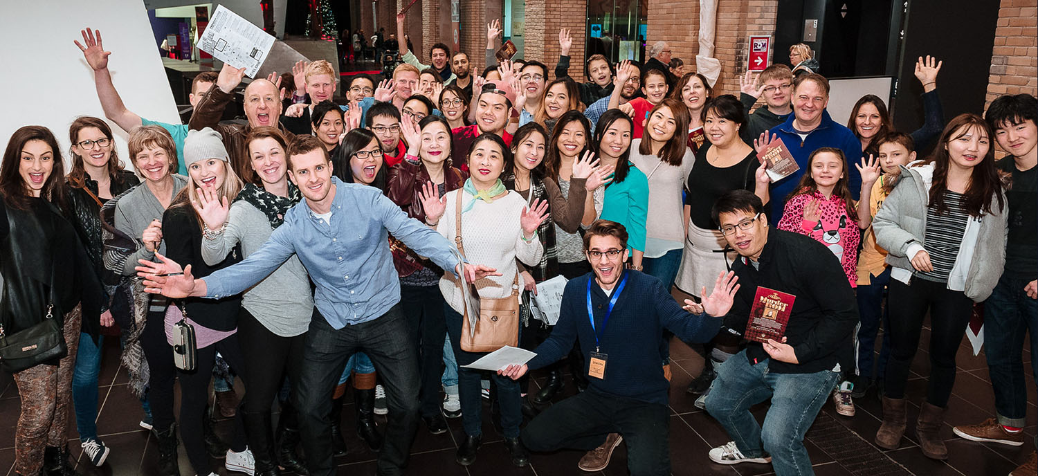 Large group of happy participants