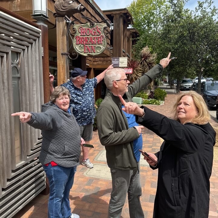 Happy hunters pointing in all directions