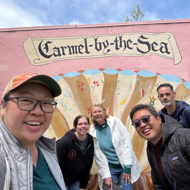 Happy hunt participants by the Carmel mural